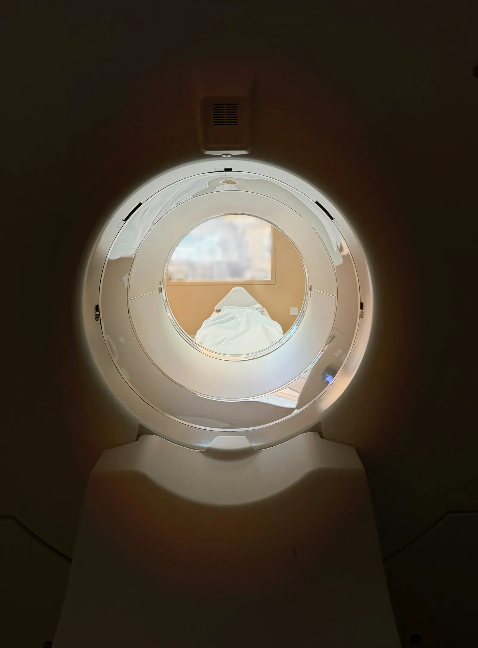 The round, softly lit opening of a hyperbaric chamber