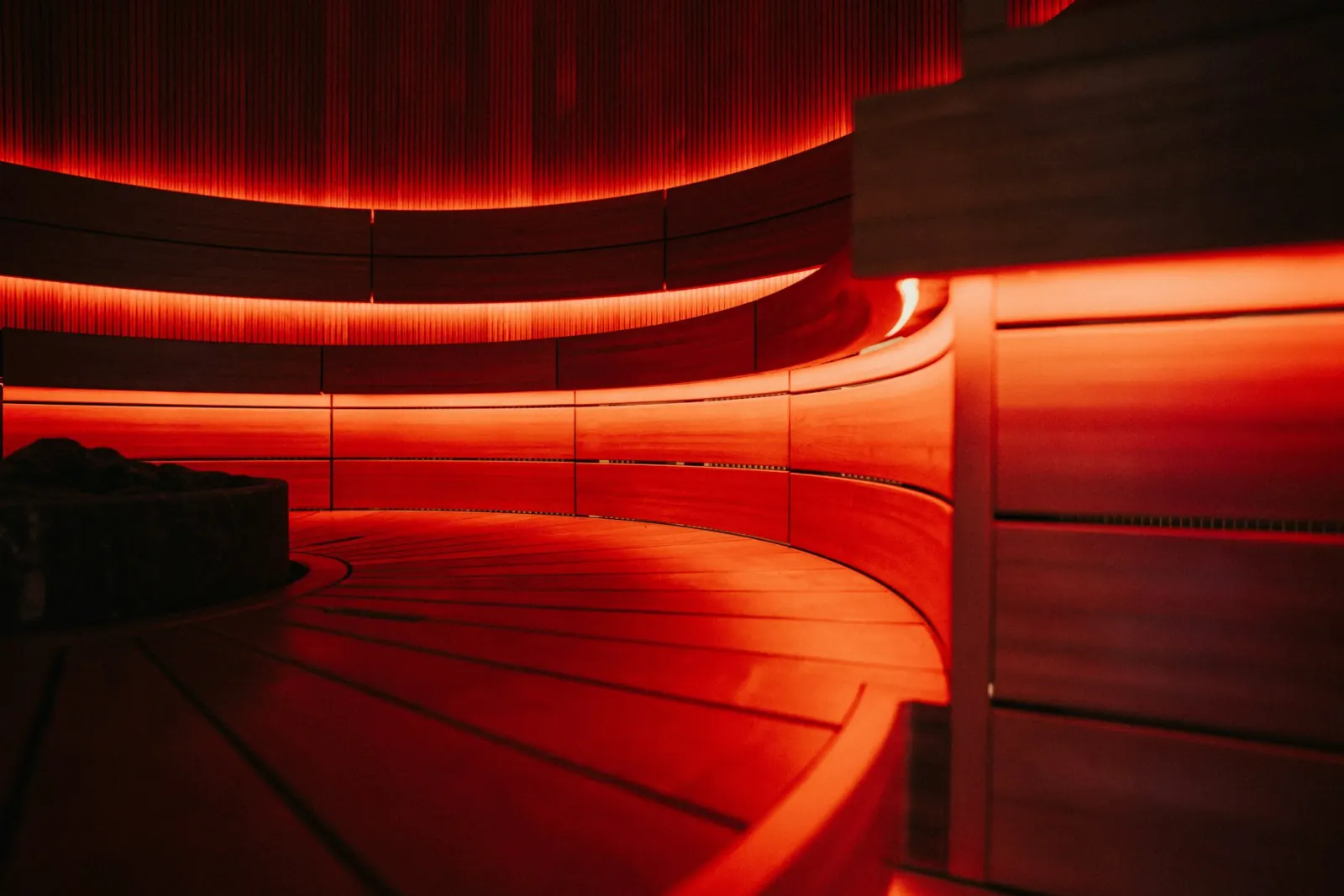 A treatment room lit by warm red light